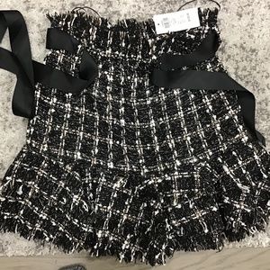 New belted ruffle bottom tweed mini skirt